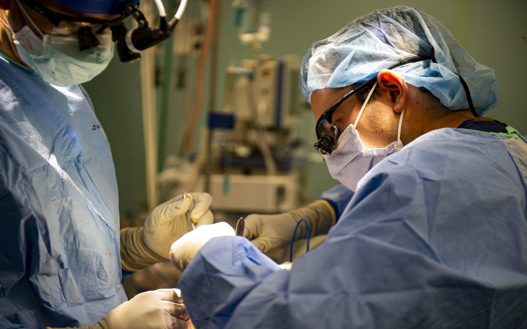 navy doctors perform a surgery aboard usns comfort